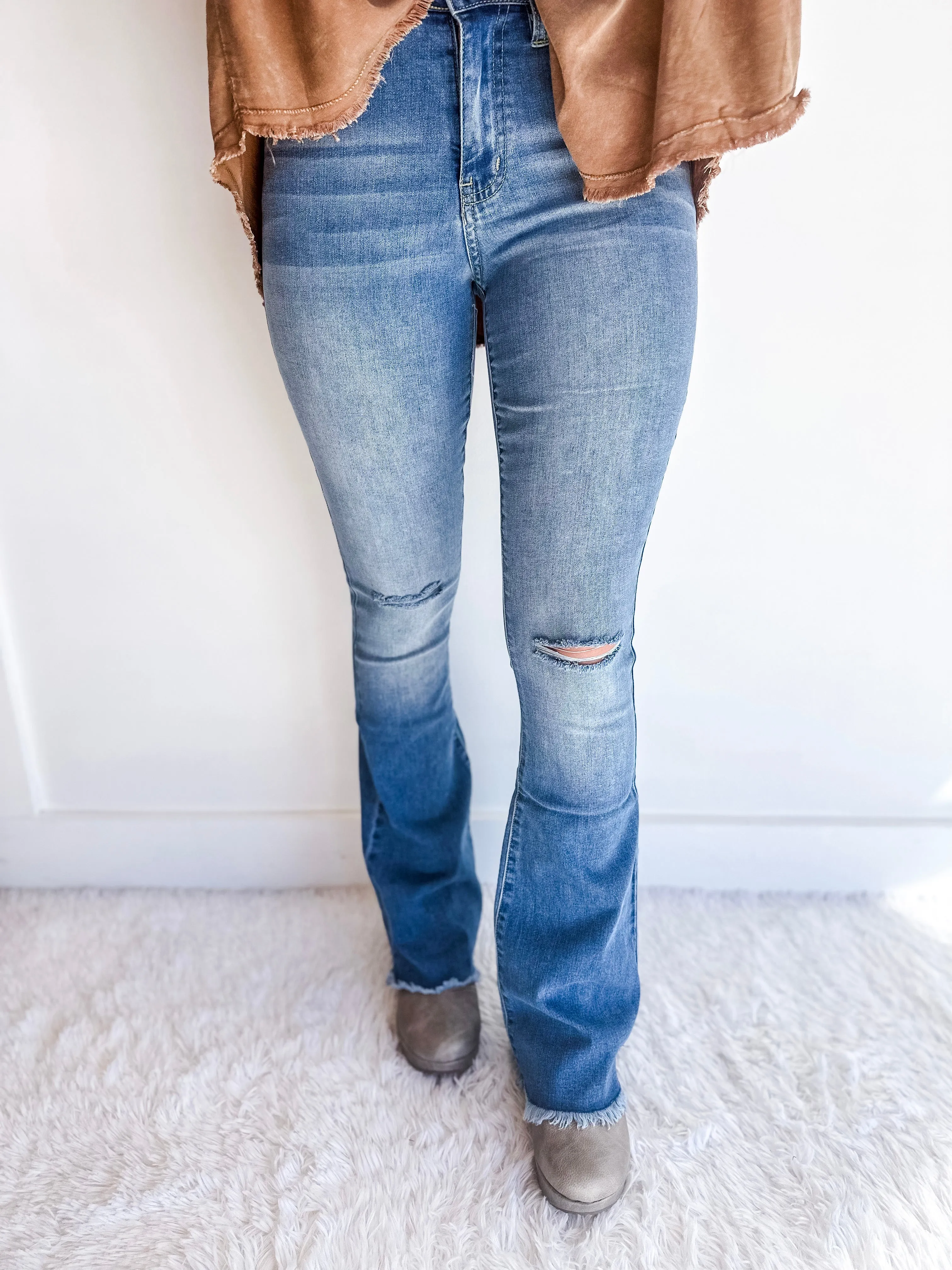 High-Rise Flared Jeans With Frayed Hem