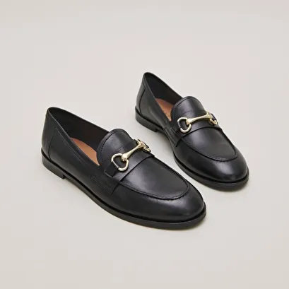 Moccasins with gold bits in black leather