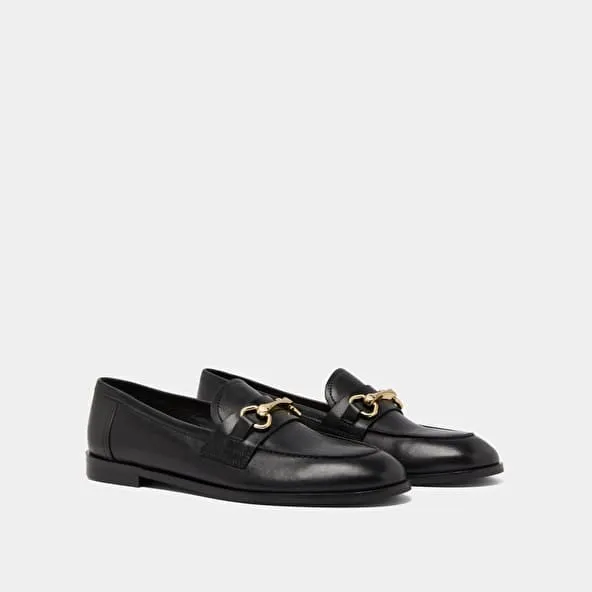 Moccasins with gold bits in black leather