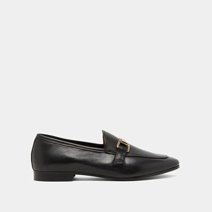 Moccasins with gold embellishment in black leather