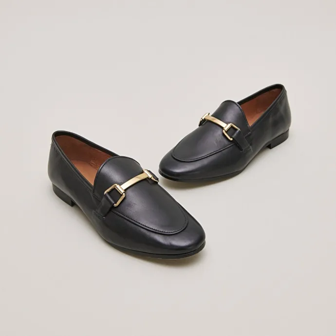 Moccasins with gold embellishment in black leather