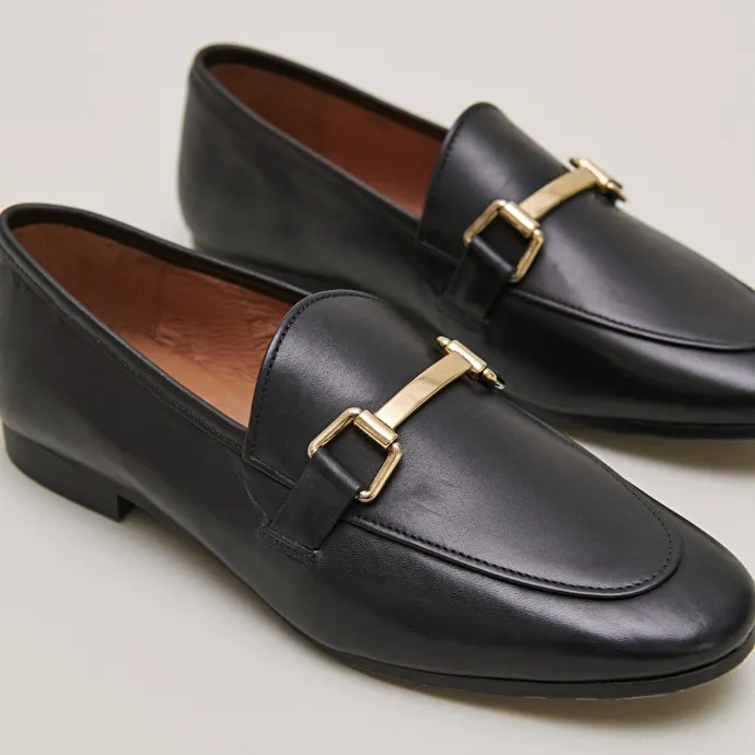 Moccasins with gold embellishment in black leather