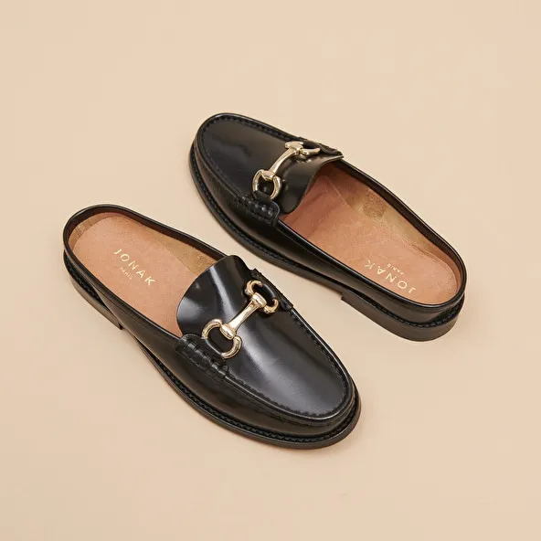 Moccasins with golden jaws in black shiny leather