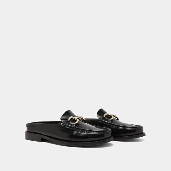 Moccasins with golden jaws in black shiny leather